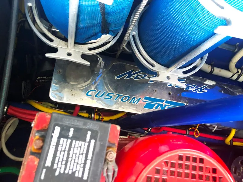 Slide: The Image of Engine compartment of 2013 Nor-Tech 477 SPX Vee Bottom boat with custom components. - 28