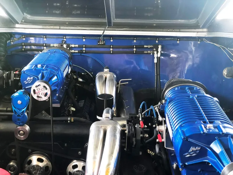 Slide: The Image of Engine compartment of 2013 Nor-Tech 477 SPX Vee Bottom with blue superchargers. - 30