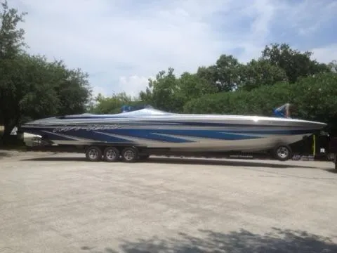 Slide: The Image of 2013 Nor-Tech 477 SPX Vee Bottom boat on trailer, parked outdoors. - 4
