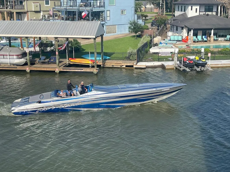 Slide: The Image of 2013 Nor-Tech 477 SPX Vee Bottom boat cruising on a sunny waterfront. - 5