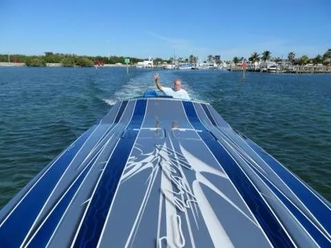Slide: The Image of 2013 Nor-Tech 477 SPX Vee Bottom speedboat cruising on a sunny day. - 7