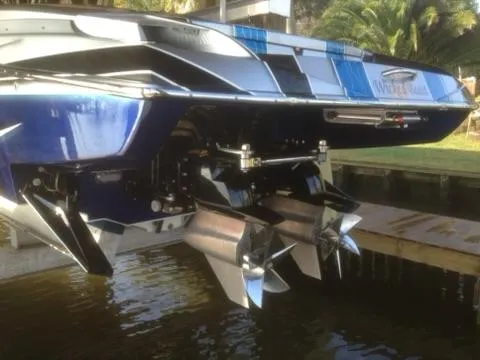 Slide: The Image of 2013 Nor-Tech 477 SPX Vee Bottom boat with dual propellers, docked near water. - 9