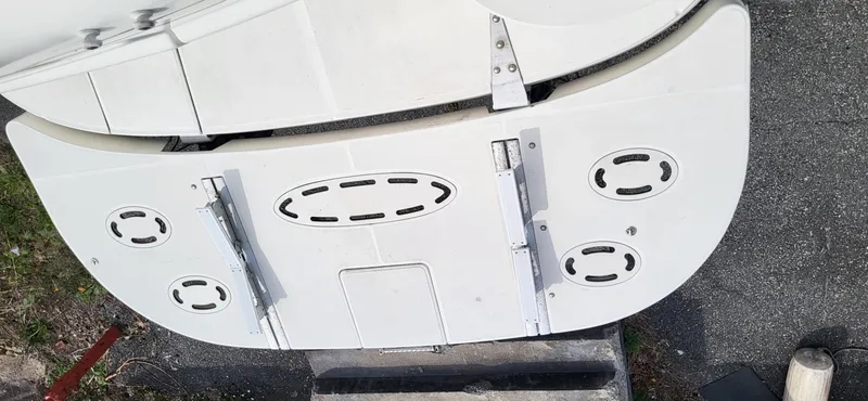Slide: The Image of 2005 Sea Ray 390 Motor Yacht swim platform with cleats and ladder, viewed from above. - 10