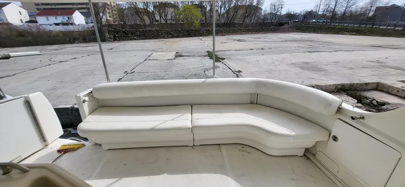 Slide: The Image of 2005 Sea Ray 390 Motor Yacht with white outdoor seating on deck. - 14