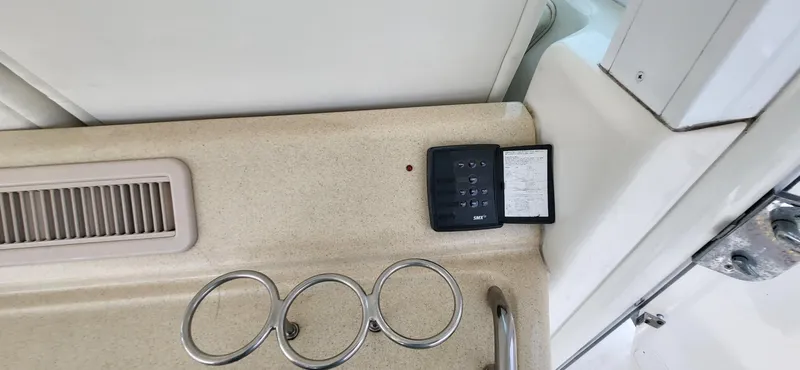 Slide: The Image of Control panel and cup holders on 2005 Sea Ray 390 Motor Yacht interior. - 17