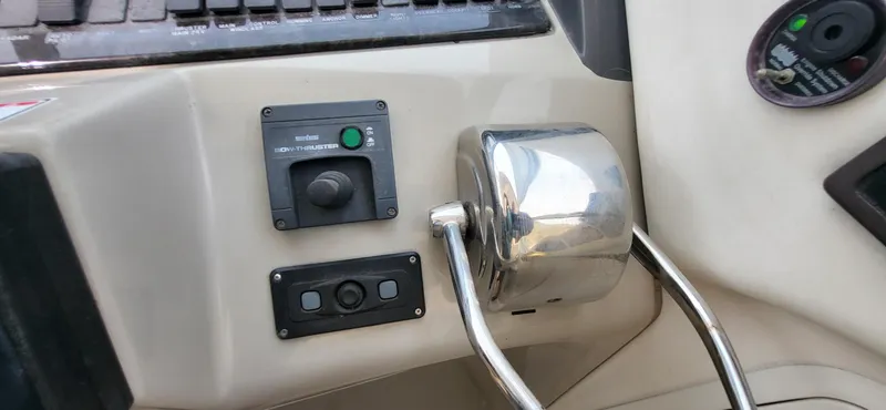 Slide: The Image of Control panel of a 2005 Sea Ray 390 Motor Yacht with bow thruster and throttle. - 19