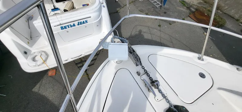 Slide: The Image of 2005 Sea Ray 390 Motor Yacht deck with anchor chain and railing. - 20