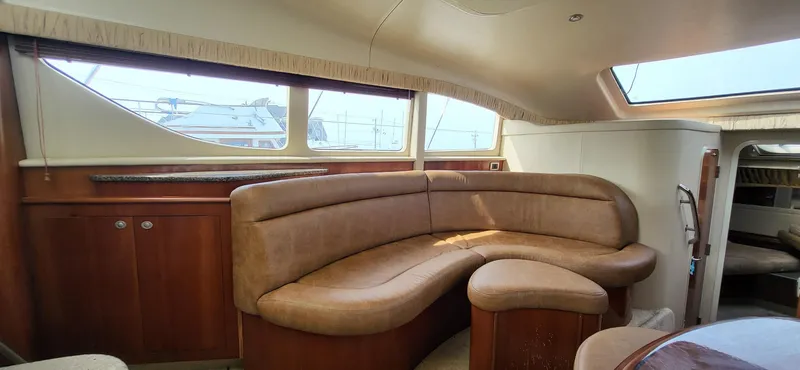 Slide: The Image of Luxurious interior of 2005 Sea Ray 390 Motor Yacht with leather seating and wood accents. - 25