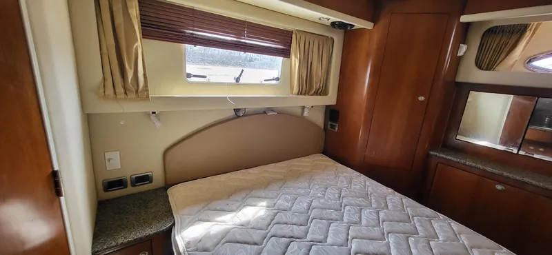 Slide: The Image of Interior cabin of 2005 Sea Ray 390 Motor Yacht with bed and window. - 28