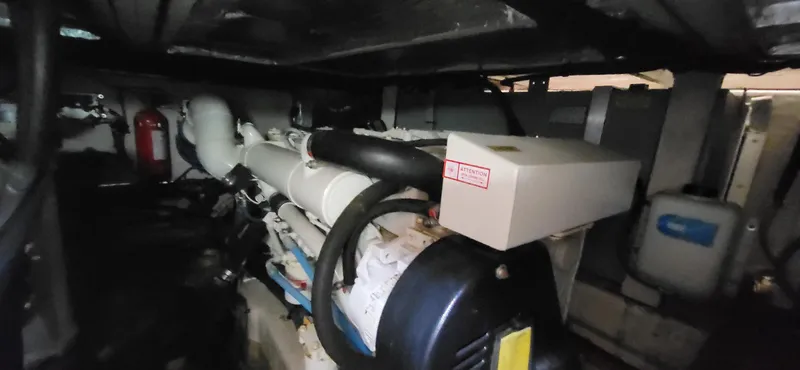 Slide: The Image of Engine room of 2005 Sea Ray 390 Motor Yacht, showcasing mechanical components and equipment. - 3