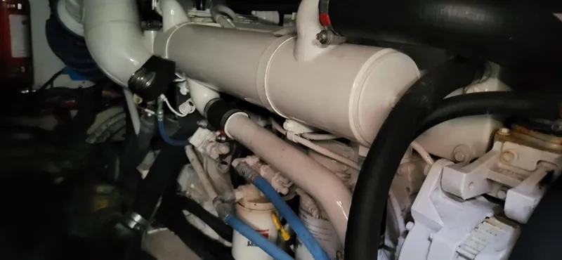 Slide: The Image of Engine compartment of a 2005 Sea Ray 390 Motor Yacht, showcasing mechanical components. - 4