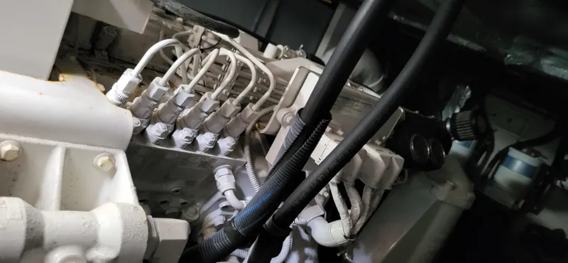 Slide: The Image of Engine compartment of a 2005 Sea Ray 390 Motor Yacht, showcasing intricate wiring and components. - 5