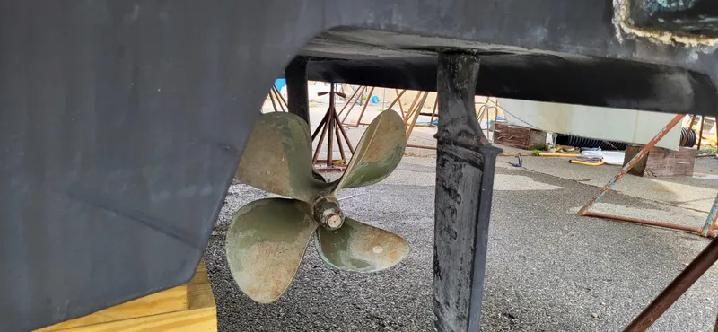 Slide: The Image of Propeller and rudder of 2005 Sea Ray 390 Motor Yacht on dry dock. - 9