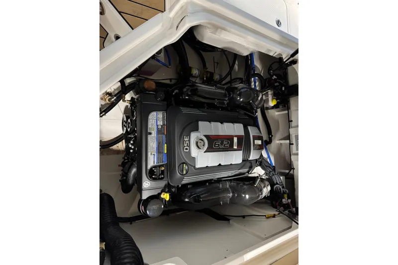 Slide: The Image of Engine compartment of 2026 Sea Ray SDX 270 Surf boat, featuring a 6.2L engine. - 12