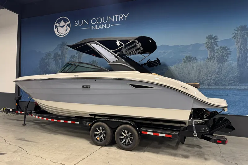 Slide: The Image of 2026 Sea Ray SDX 270 Surf boat on trailer at Sun Country Inland showroom. - 4