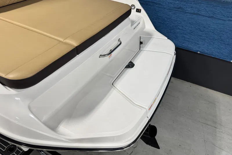 Slide: The Image of 2026 Sea Ray SDX 270 Surf boat with tan seating and white swim platform. - 7