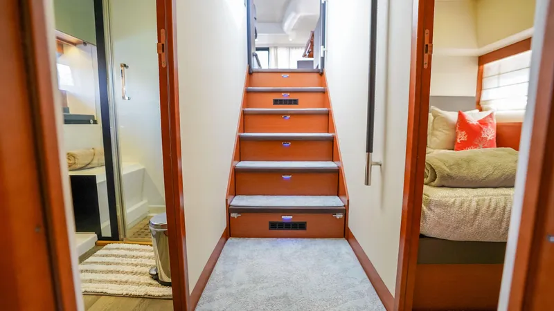 Slide: The Image of Interior of 2015 Prestige 550 Flybridge yacht with stairs, bedroom, and bathroom. - 23