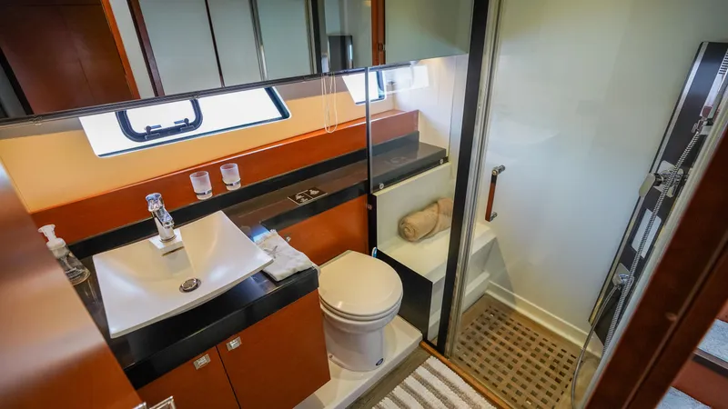 Slide: The Image of Luxurious bathroom in 2015 Prestige 550 Flybridge yacht with modern fixtures and shower. - 27