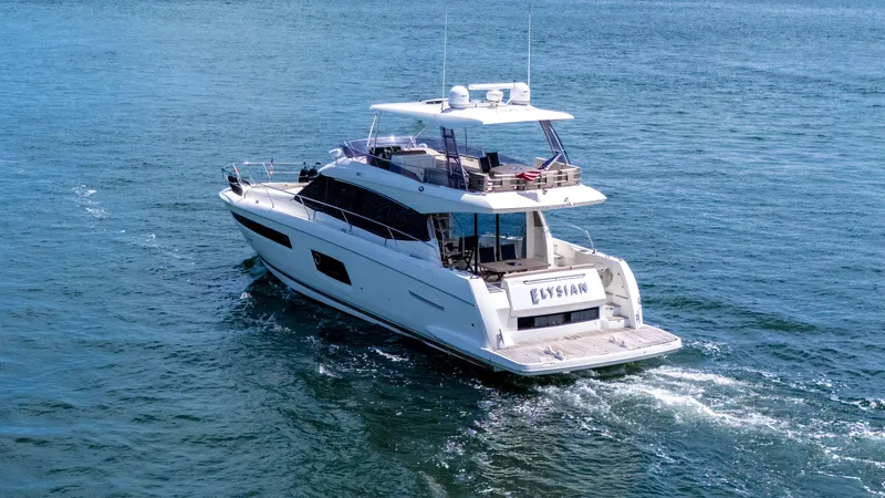 Slide: The Image of Prestige 550 Flybridge yacht cruising on open water, 2015 model. - 3