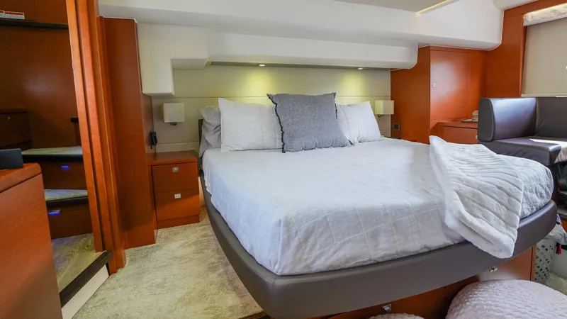 Slide: The Image of Luxurious bedroom interior of 2015 Prestige 550 Flybridge yacht with modern furnishings. - 30