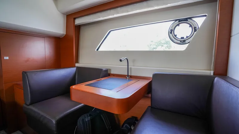 Slide: The Image of Interior of 2015 Prestige 550 Flybridge yacht with seating and window view. - 34