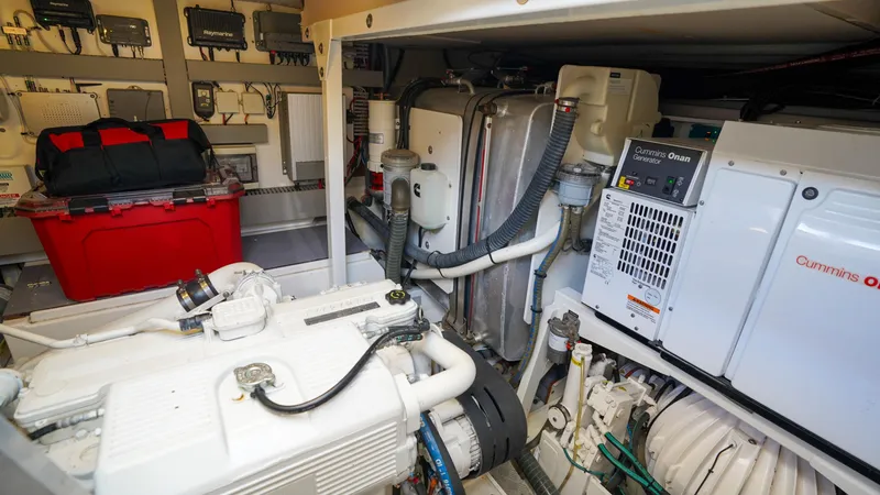 Slide: The Image of Engine room of 2015 Prestige 550 Flybridge yacht with Cummins Onan generator. - 48