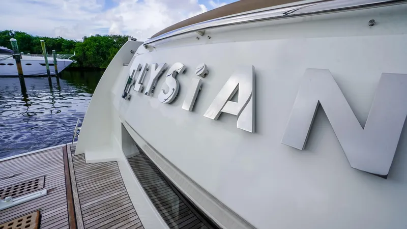 Slide: The Image of Prestige 550 Flybridge yacht, 2015 model, docked with "ELYSIAN" nameplate. - 8