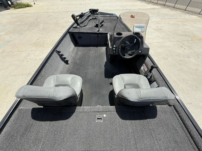Slide: The Image of 2020 Bass Tracker Classic XL boat interior with steering console and two seats. - 8