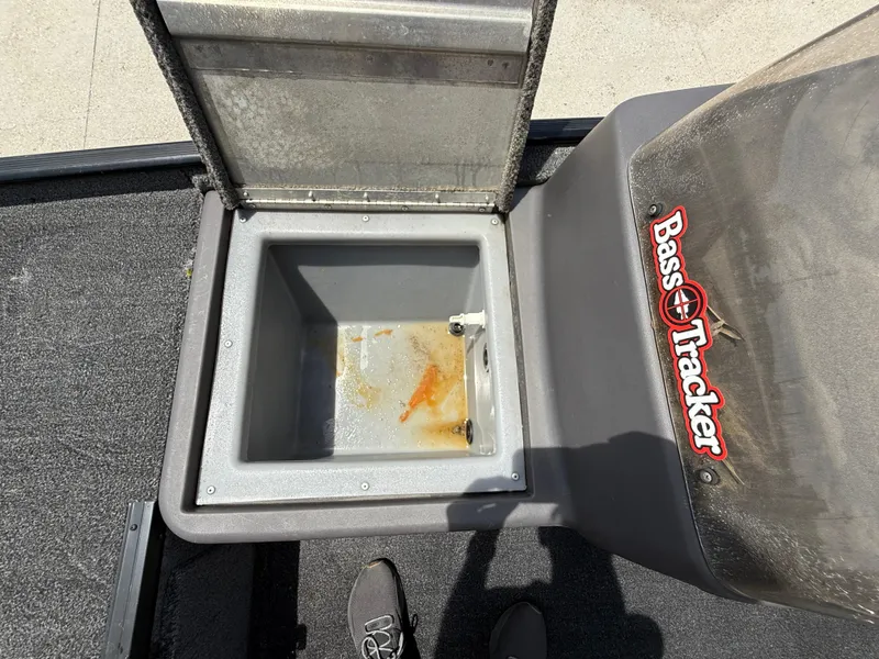 Slide: The Image of Open storage compartment on 2020 Bass Tracker Classic XL boat, showing interior details. - 13