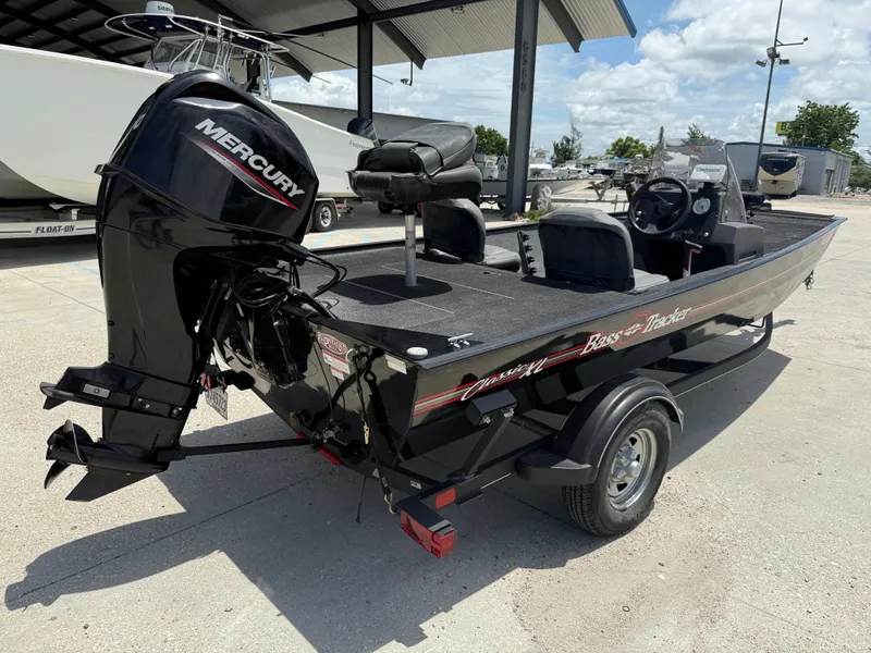 Slide: The Image of 2020 Bass Tracker Classic XL boat with Mercury engine, parked outdoors. - 7