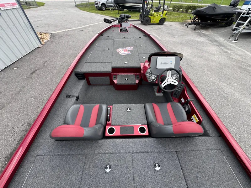 Slide: The Image of 2022 Vexus AVX2080 boat interior with Garmin system, red and black seats, and steering wheel. - 12