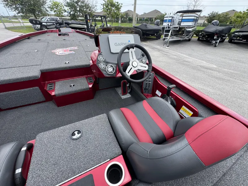 Slide: The Image of 2022 Vexus AVX2080 boat interior with Garmin display and red-black seating. - 13