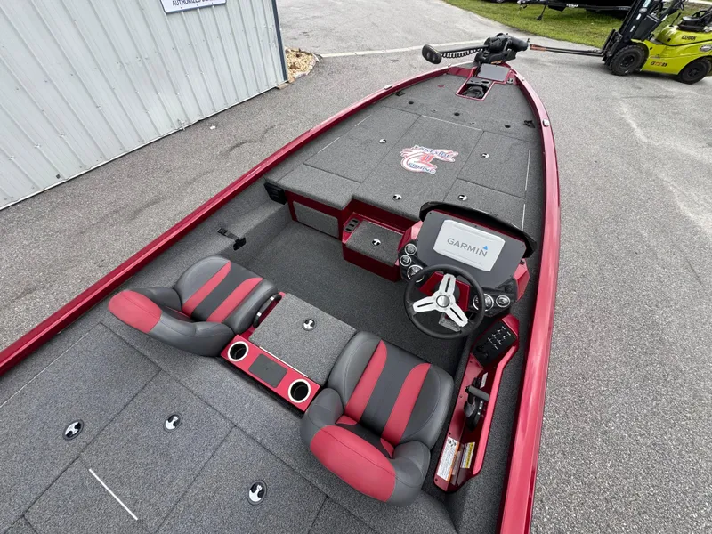 Slide: The Image of 2022 Vexus AVX2080 boat interior with Garmin system, red and gray seating, and spacious deck. - 15