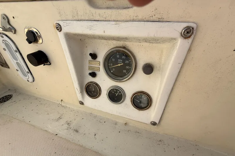 Slide: The Image of Control panel of a 1979 Gulfstar 43 MK II boat with gauges and switches. - 15