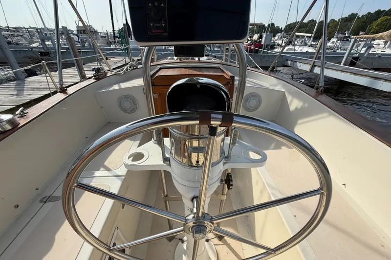 Slide: The Image of Cockpit view of a 1979 Gulfstar 43 MK II sailboat with steering wheel. - 16