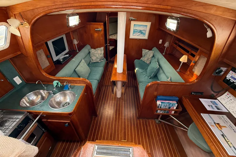 Slide: The Image of Interior of 1979 Gulfstar 43 MK II yacht with cozy seating and wooden finishes. - 22