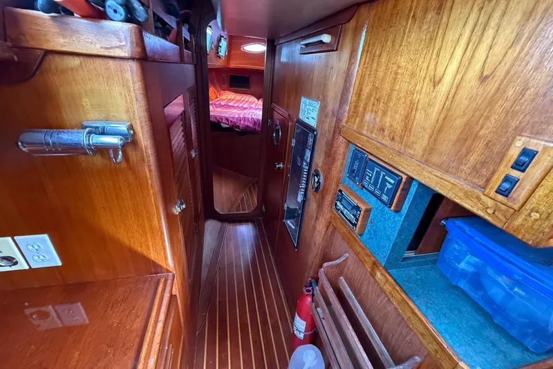 Slide: The Image of Interior of 1979 Gulfstar 43 MK II yacht with wooden cabinetry and cozy sleeping area. - 35