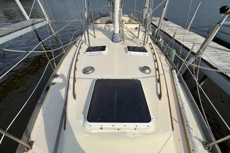 Slide: The Image of 1979 Gulfstar 43 MK II sailboat deck with hatches, docked at marina. - 6