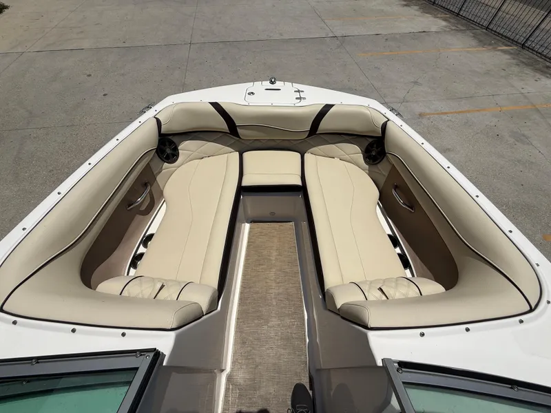 Slide: The Image of 2018 Regal 22 FasDeck boat interior with beige seating and modern design. - 12
