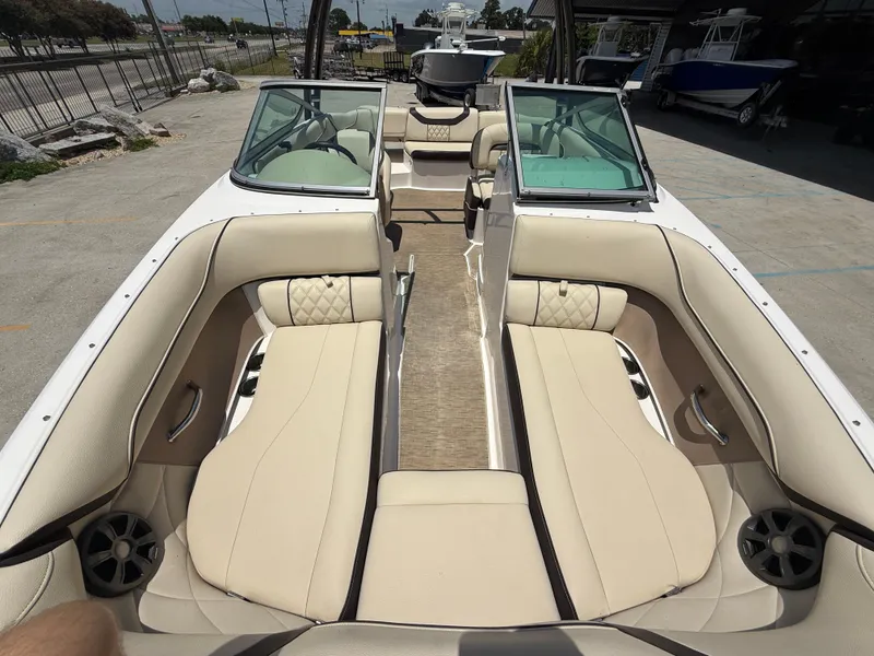 Slide: The Image of 2018 Regal 22 FasDeck boat interior with beige seating and modern design. - 13