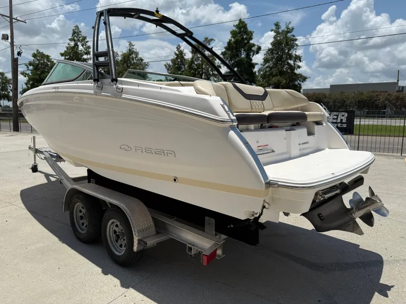 Slide: The Image of 2018 Regal 22 FasDeck boat on trailer, rear view, sunny day. - 5