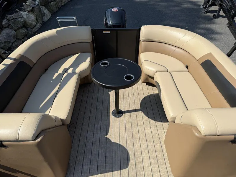 Slide: The Image of Luxurious seating area on a 2022 Viaggio L22U boat with beige upholstery and a central table. - 13