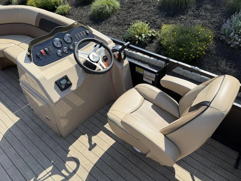 Slide: The Image of Viaggio L22U 2022 boat helm with beige captain's chair and control panel. - 14