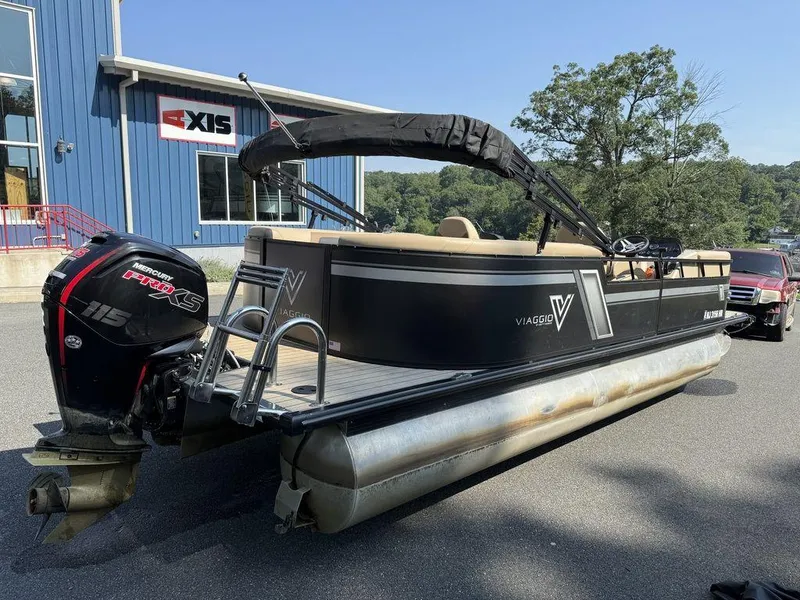 Slide: The Image of 2022 Viaggio L22U pontoon boat with Mercury 115 Pro XS engine, parked outdoors. - 3
