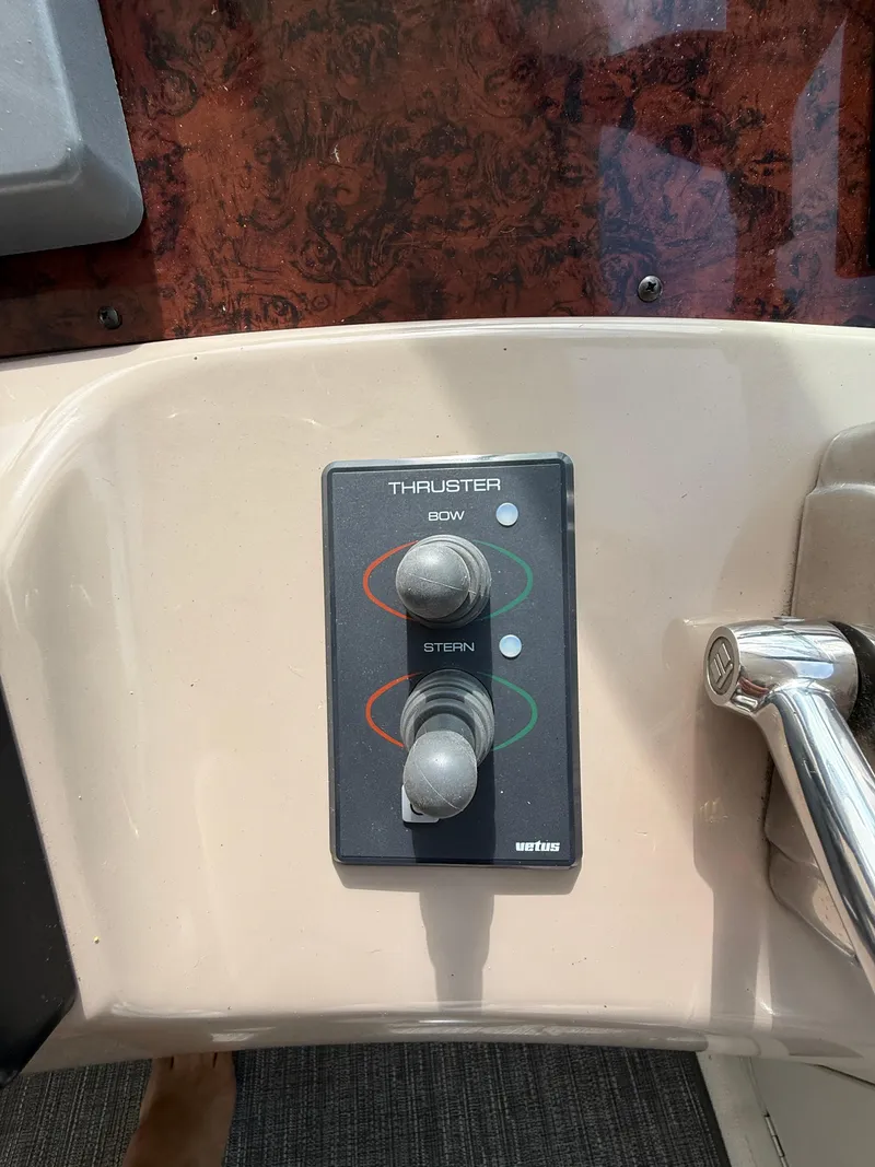 Slide: The Image of Control panel of a 2000 Sea Ray 460 Sundancer boat, featuring bow and stern thruster controls. - 19