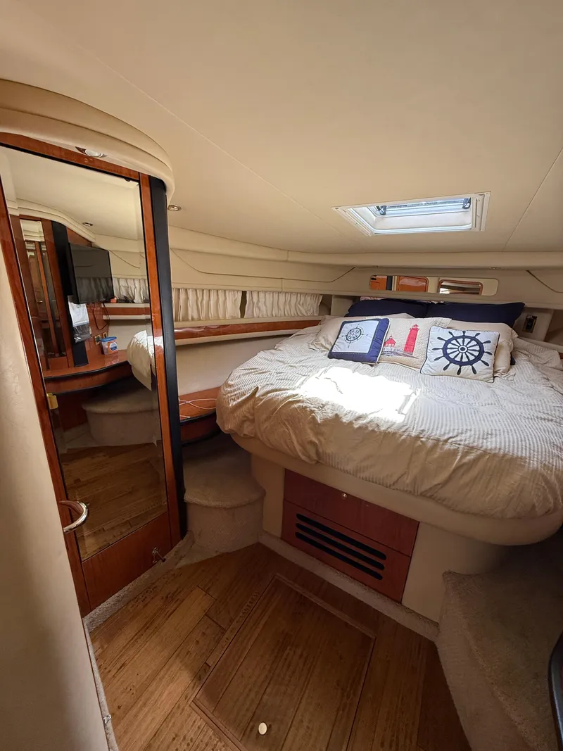 Slide: The Image of Luxurious cabin interior of 2000 Sea Ray 460 Sundancer yacht with cozy bedding. - 25