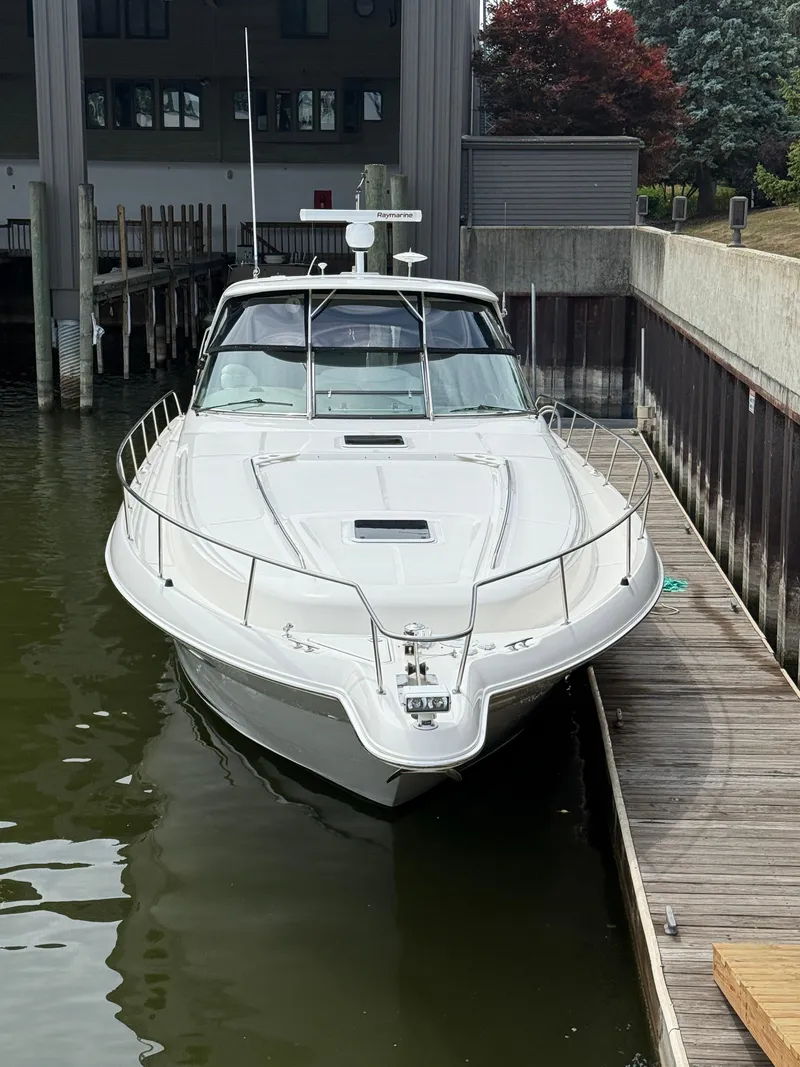 Slide: The Image of 2000 Sea Ray 460 Sundancer yacht docked in a marina. - 3