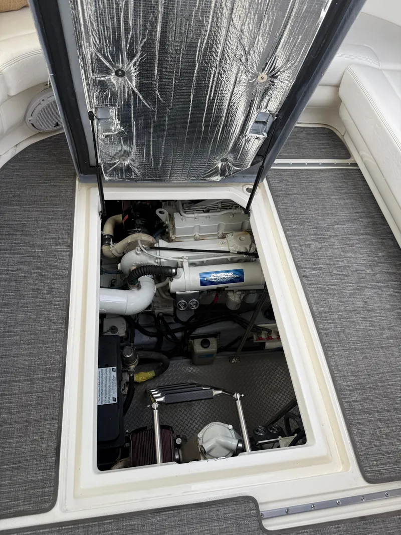 Slide: The Image of Engine compartment of a 2000 Sea Ray 460 Sundancer yacht, showcasing mechanical components. - 34