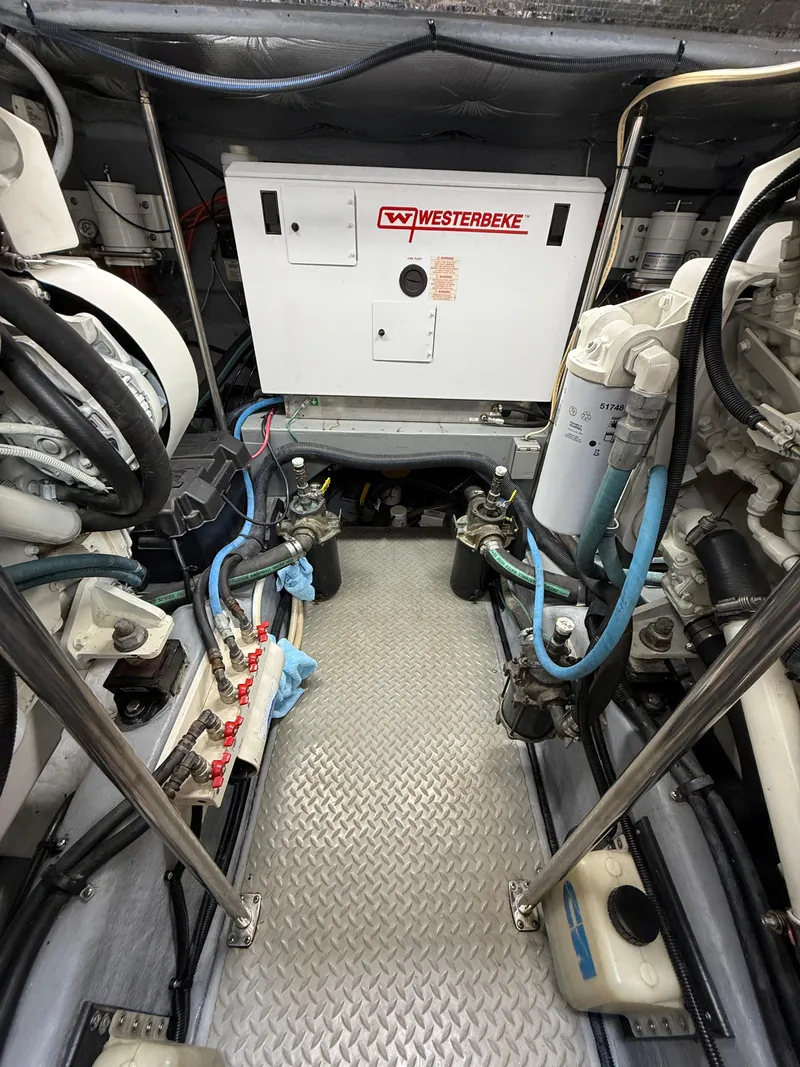 Slide: The Image of Engine room of 2000 Sea Ray 460 Sundancer with Westerbeke generator and mechanical components. - 35
