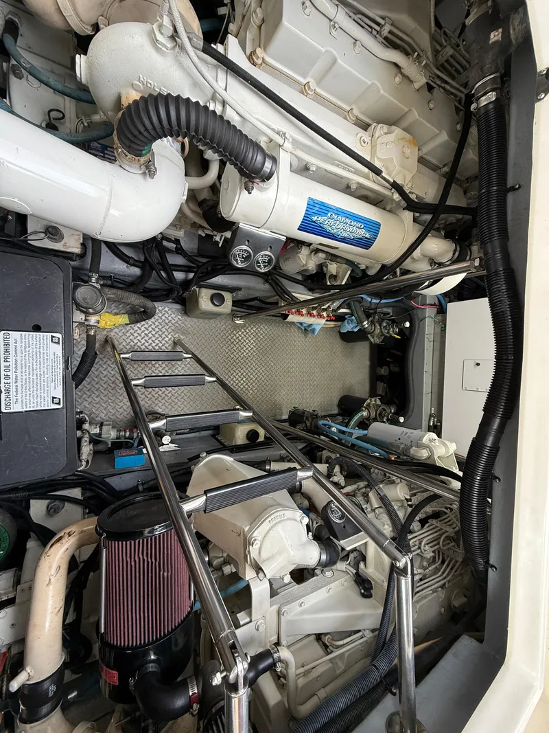 Slide: The Image of Engine room of a 2000 Sea Ray 460 Sundancer yacht, showcasing mechanical components. - 40